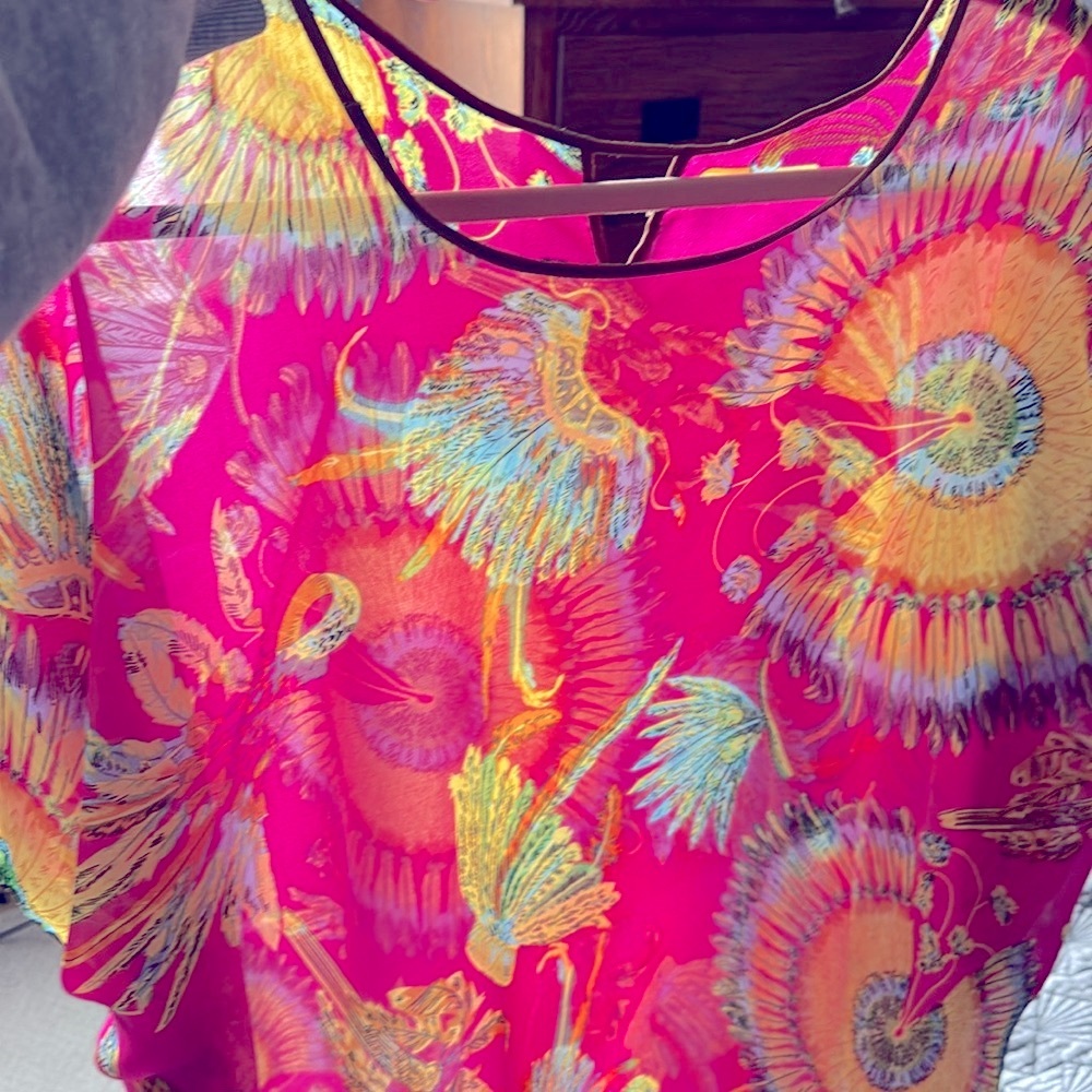 Women’s colorful tunic top bright colors of pink gold, blues, and greens…